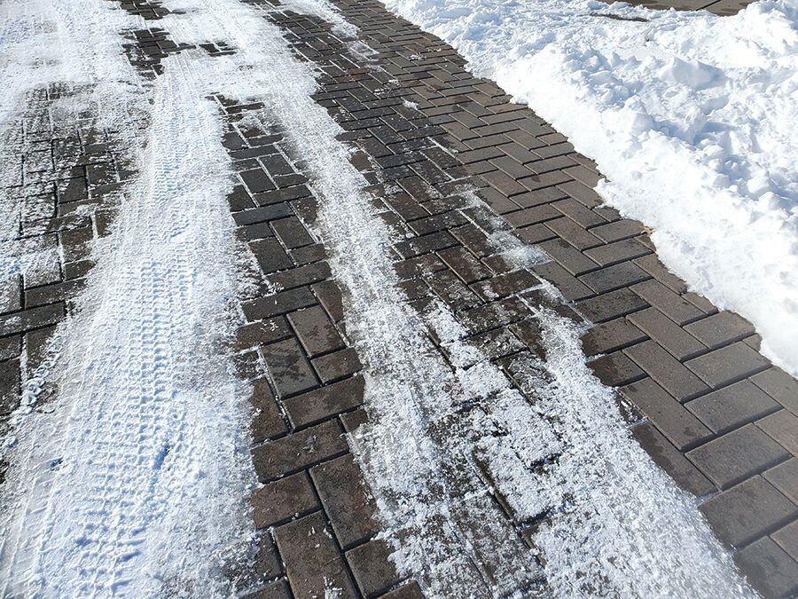 Melting snow drains immediately through permeable pavers, eliminating the risk of re-freeze.